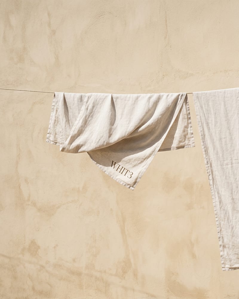 Linen cloth hanging to dry in strong sunlight
