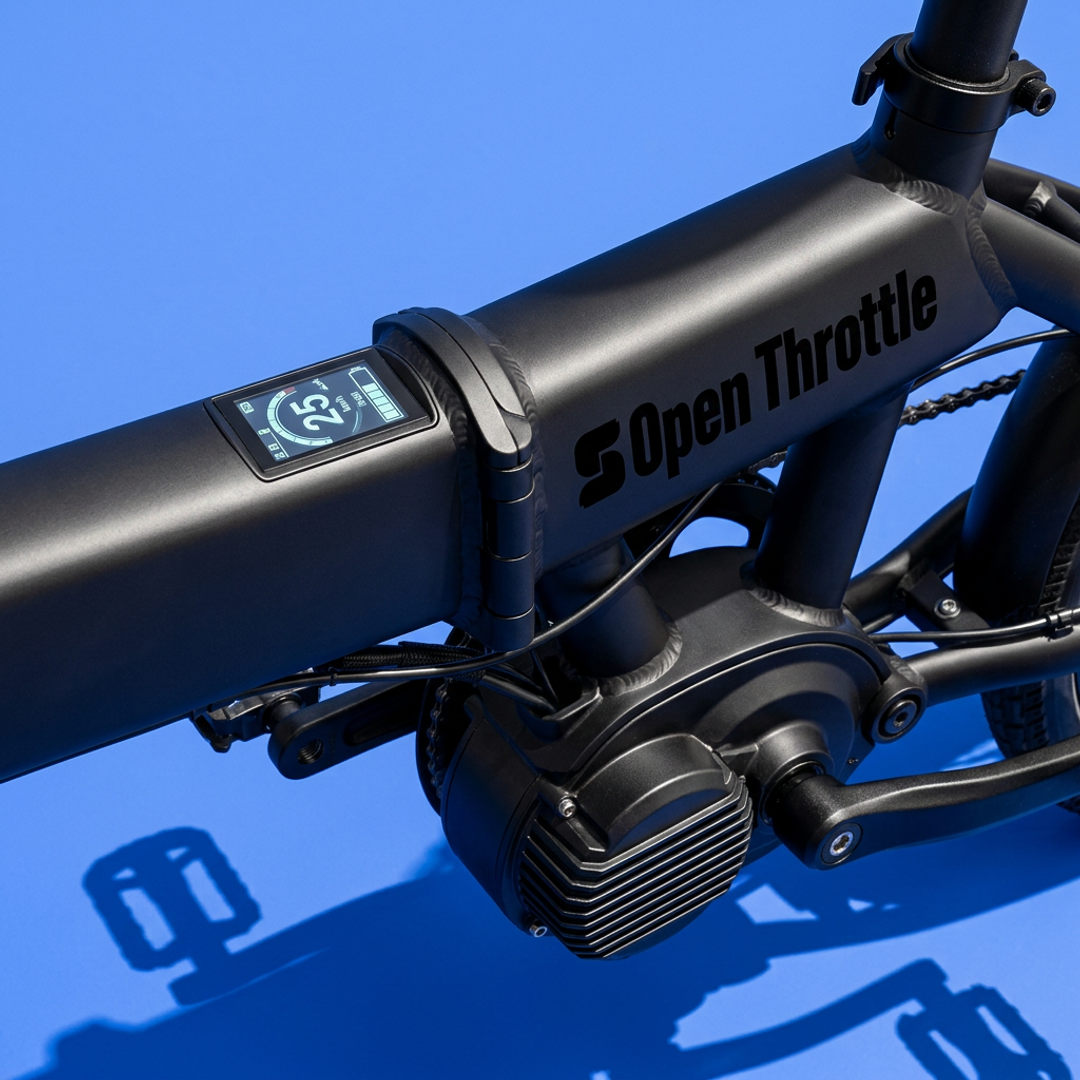 Open Throttle e-bike shown at close range, highlighting the UL-certified electrical system components and frame build quality.